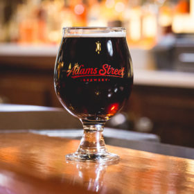 Adams Street Brewery Snifter Glass with craft beer.