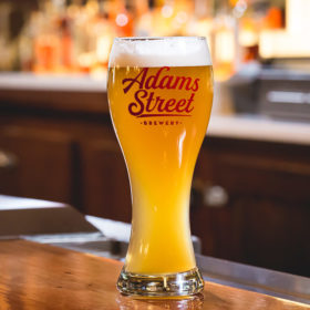 Adams Street Brewery Weiss Glass with craft beer.