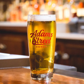 Adams Street Brewery Willi Becher Glass with craft beer.